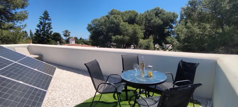 Rooftop Solarium: Bistro Table with Sea & Pine Views