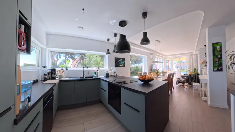 Sunlit Kitchen Perspective Facing Pool & Lawn